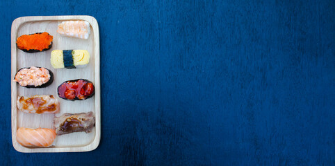 Zushi set is a Japanese dish that is placed on a wooden plate to add beauty to it even more.