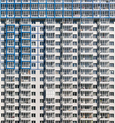 Naklejka premium White facade of a multi-storey residential building