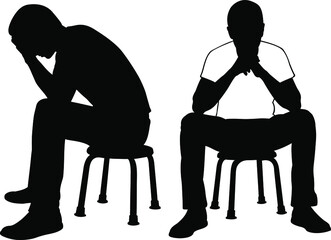 silhouettes of sad men on chairs - 433474216