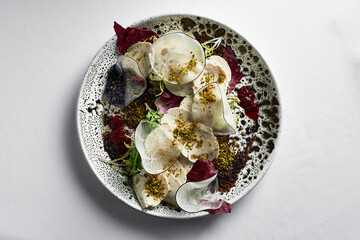Close up on traditional italian cuisine Vitello tonnato. A dish with pickled veal with tuna cream...