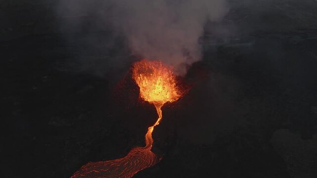 Fountain of magma and lapilli erupting from volcano crater, Fagradalsfjall in Iceland. Aerial view