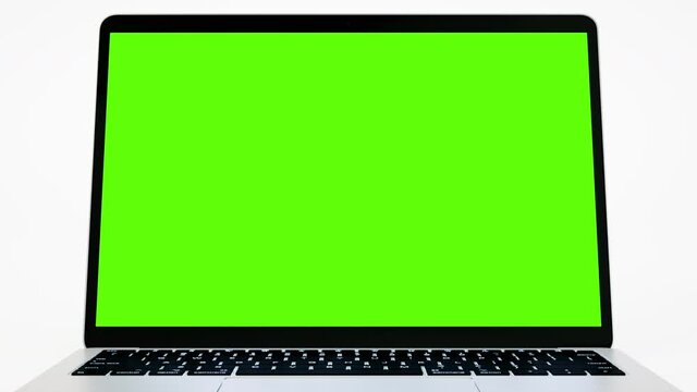 Empty Green Screen Display Laptop for Watching and Paste Background e Business Blog or Gaming App. Copy 3d Pc with Clear Chroma Key for Mockup. Concept Computer Technological Video Call Close-Up 4k