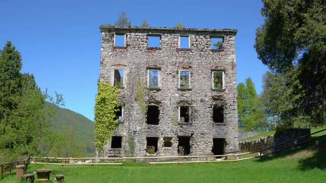 Ruins of old castle Haasberg in Slovenia. Historic mansion remains in beautiful green park. Collapsed walls of mightiest Baroque castle on Slovenian soil. Wide angle, tilt up