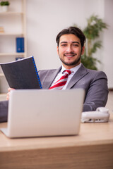 Young businessman employee working in the office