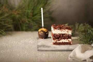 chocolate cake with cream is on the table