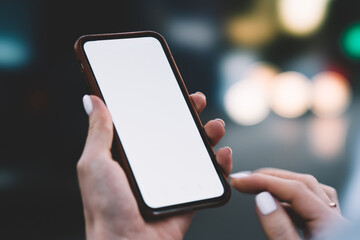 Anonymous woman with empty screen on smartphone