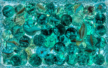 glass balls in mineral water with bubbles