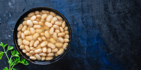 white beans cooked ready to eat beans boiled legumes on the table healthy food meal snack copy...