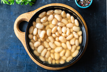 white beans cooked ready to eat beans boiled legumes on the table healthy food meal snack copy space food background rustic. top view keto or paleo diet