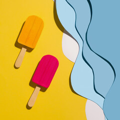 Bath bombs on the beach made of paper. View from above