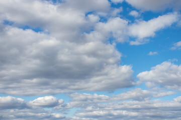 Naklejka na ściany i meble blue sky with ragged clouds in good weather
