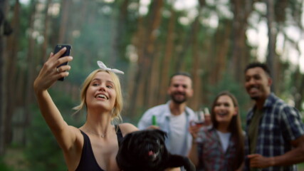 Friendly people posing for photo outside. Cheerful guys making selfie outdoors