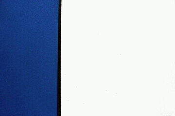 One third of blue and two third of white background separated by a vertical black line.   