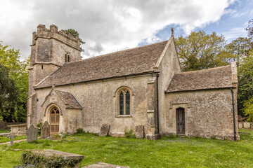 Fototapeta na wymiar The parish church with 15th century tower in the village of Easton Grey, Wiltshire, England, United Kingdom