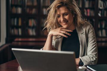 Businesswoman using a laptop for an online meeting while in the office
