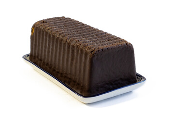 Fresh tasty flavored chocolate muffin on a rectangular plate close-up, isolated on white background Chocolate loaf cake