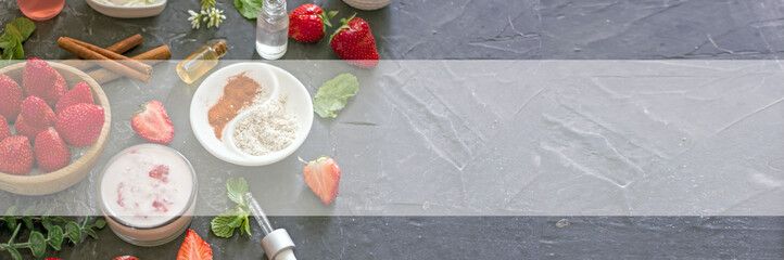 Ingredients homemade strawberry face mask, cream, strawberry, oatmeal, spices, herbs on a dark background, top view, copy space, flat lay, banner. Home hand-made cosmetics made from natural ingredient