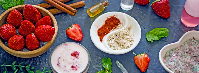 Ingredients homemade strawberry face mask, cream, strawberry, oatmeal, spices, herbs on a dark background, top view, copy space, flat lay, banner. Home hand-made cosmetics made from natural ingredient