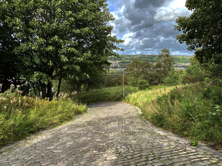 View down a Victorian cobbled road, in Braithwaite, Keighley, UK