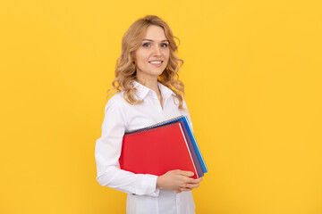 happy blonde businesswoman woman in white shirt hold notepad or notebook, school teacher