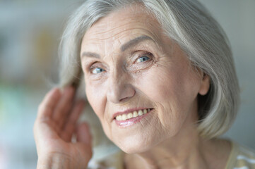 portrait of happy senior woman at home