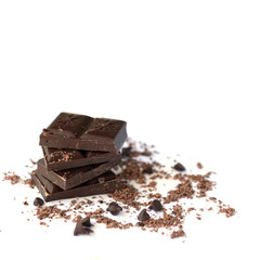 Dark chocolate stack with flakes powder isolated on white background