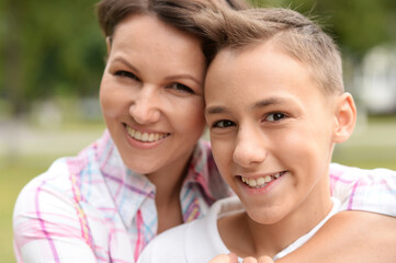 Obraz premium Beautiful mother with son in park