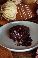 Vegan and gluten free chocolate lava cake with raspberries jam