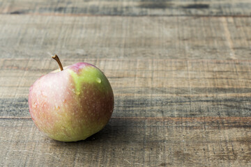 One fresh apple on a wooden tabletop fruit diet