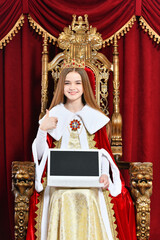 Fototapeta premium Portrait of beautiful teen girl holding laptop