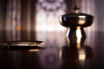 First Holy Communion. Catholic religion theme. Crucifix, the Croass and Golden chalice and wafer on...