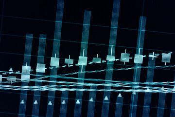 Financial data of stock market in term of a digital prices on LED display. A number of daily market price and quotation of prices chart to represent candle stick tracking in Forex trading.