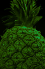 Fototapeta premium Macro close up portrait of a Pineapple, black background
