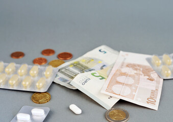 Health money pills medicine isolated on grey background