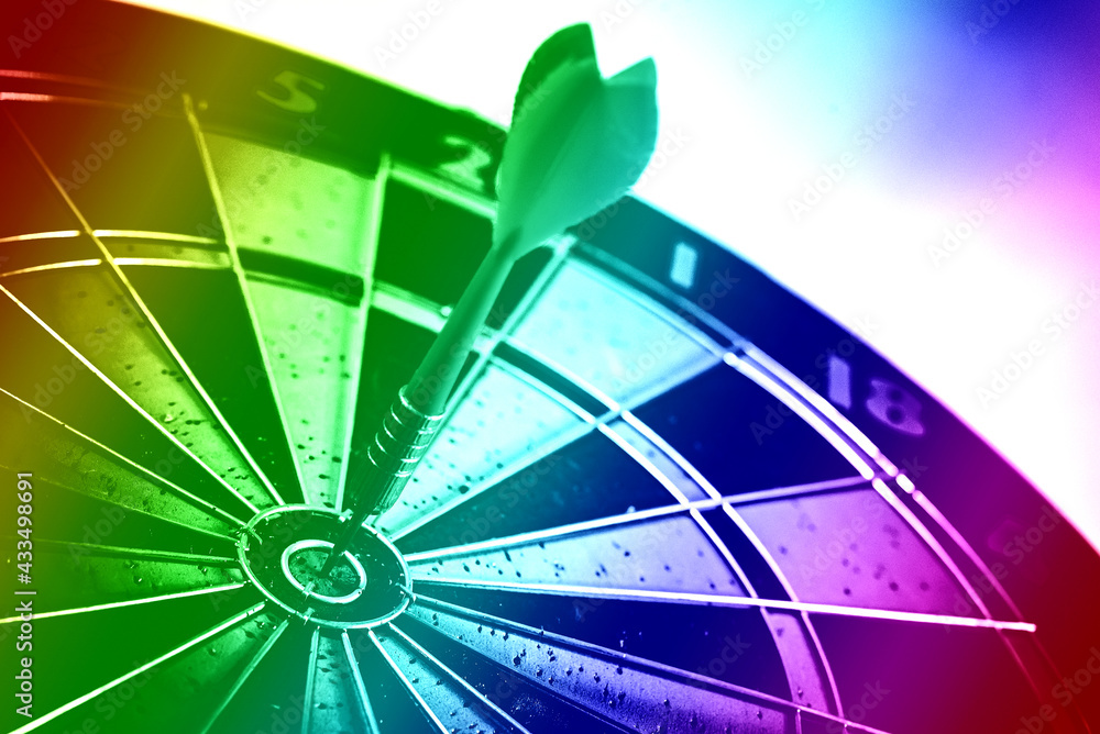Poster close up shot of the dart arrow hit on bulleyes of dartboard to represent that the business reached 