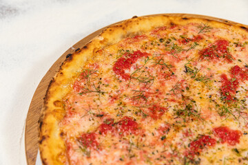 Pizza Homemade Artesanale Close Up Detail on a Round Wooden Plate with Flour Background Table