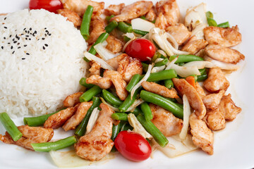 Roasted chicken breast with green bean pods, cherry tomatoes, served with rice