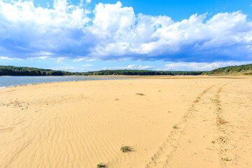 Fototapeta na wymiar Beautiful sandy beach at Chancza lake in Swietokrzyskie region in central Poland