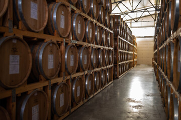 wooden wine's barrels in warehouse