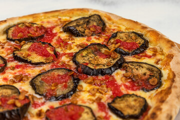 Pizza Aubergine Cheese Rustic Tomate Sauce Homemade Artesanale Close Up Detail on a Round Wooden Plate with Flour Background Table