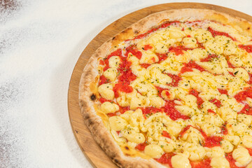 Catupiry Cheese Pizza Homemade Artesanale Close Up Detail on a Round Wooden Plate with Flour Background Table
