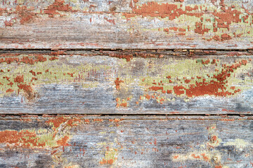 Wide brown boards. Aged dilapidated wall.