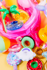 many inflatable pool inflatables in different shapes and colors