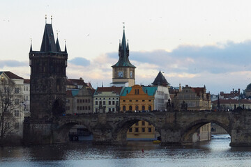 View of the medieval Charles Bridge over the Vltava River, connecting the historical districts of...