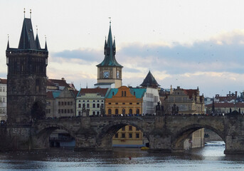 View of the medieval Charles Bridge over the Vltava River, connecting the historical districts of...