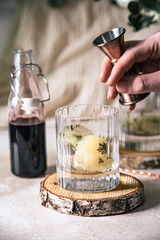 Bartender set cocktail with elderberry syrup
