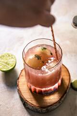 pink elderberry mocktail in a glass