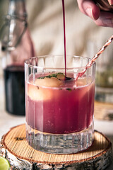 pink elderberry mocktail in a glass