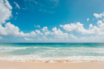 Fototapeta na wymiar A bright sunny day at Macao Beach, Dominican Republic, Caribbean. Blue ocean and bright sky with clouds. Tropical beach