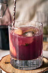 pink elderberry mocktail in a glass